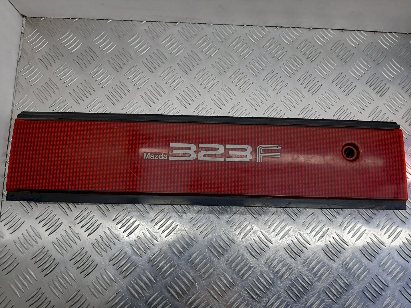 Накладка под номер (бленда) - Mazda 323 BG (1989-1994)